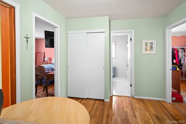 a bedroom with a bed and a mirror