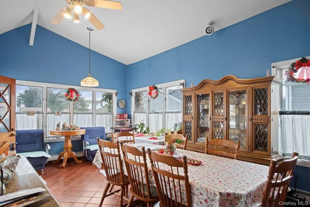 a view of a dining room with furniture window and outside view