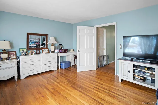 a room with furniture and wooden floor