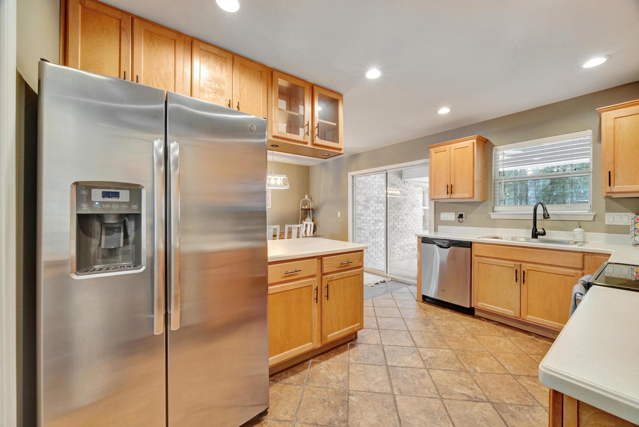 1141 Country Living Road Baker, FL 32531 - Photo 19 of 60 a kitchen with stainless steel appliances granite countertop a refrigerator and a sink