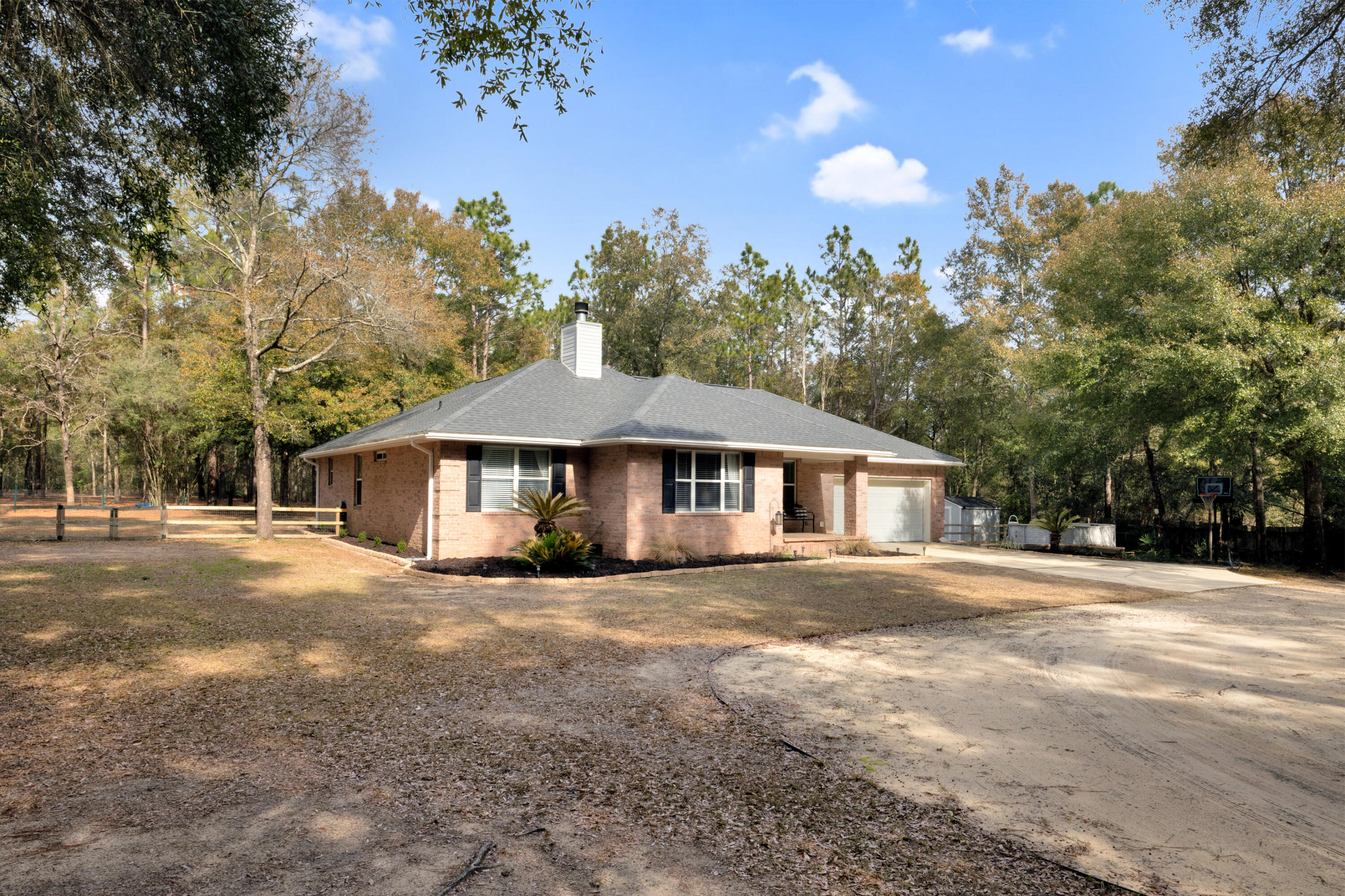1141 Country Living Road Baker, FL 32531 - Photo 3 of 60 a view of a house with a yard