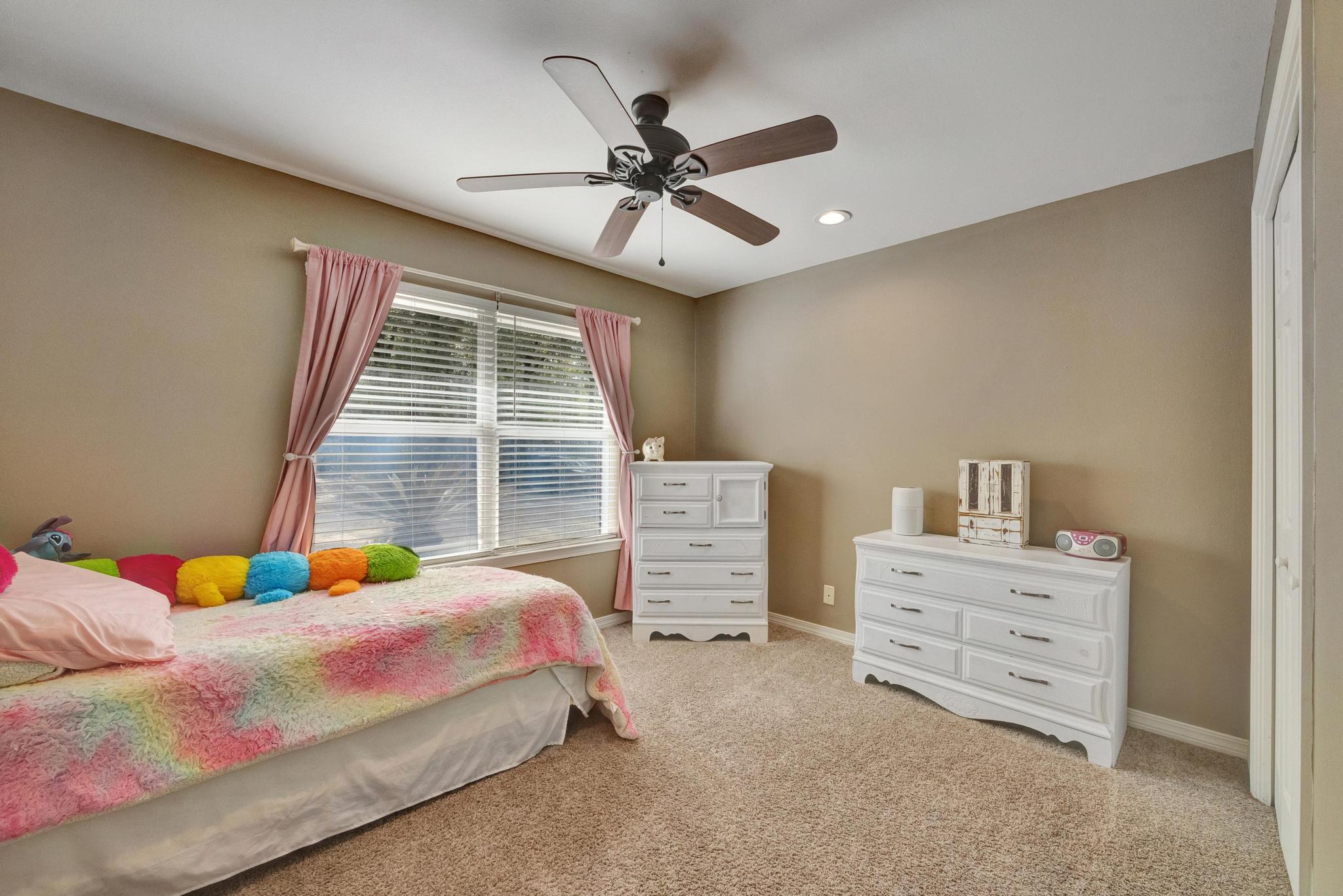 1141 Country Living Road Baker, FL 32531 - Photo 36 of 60 a bedroom with a bed and a window