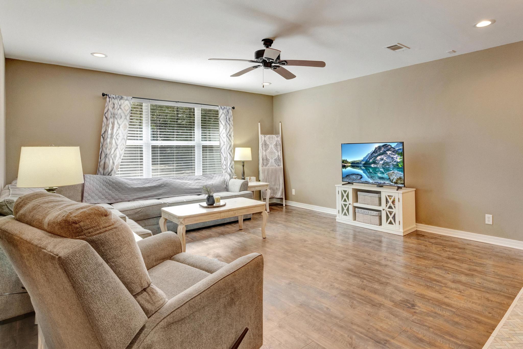 1141 Country Living Road Baker, FL 32531 - Photo 5 of 60 a living room with furniture and a large window