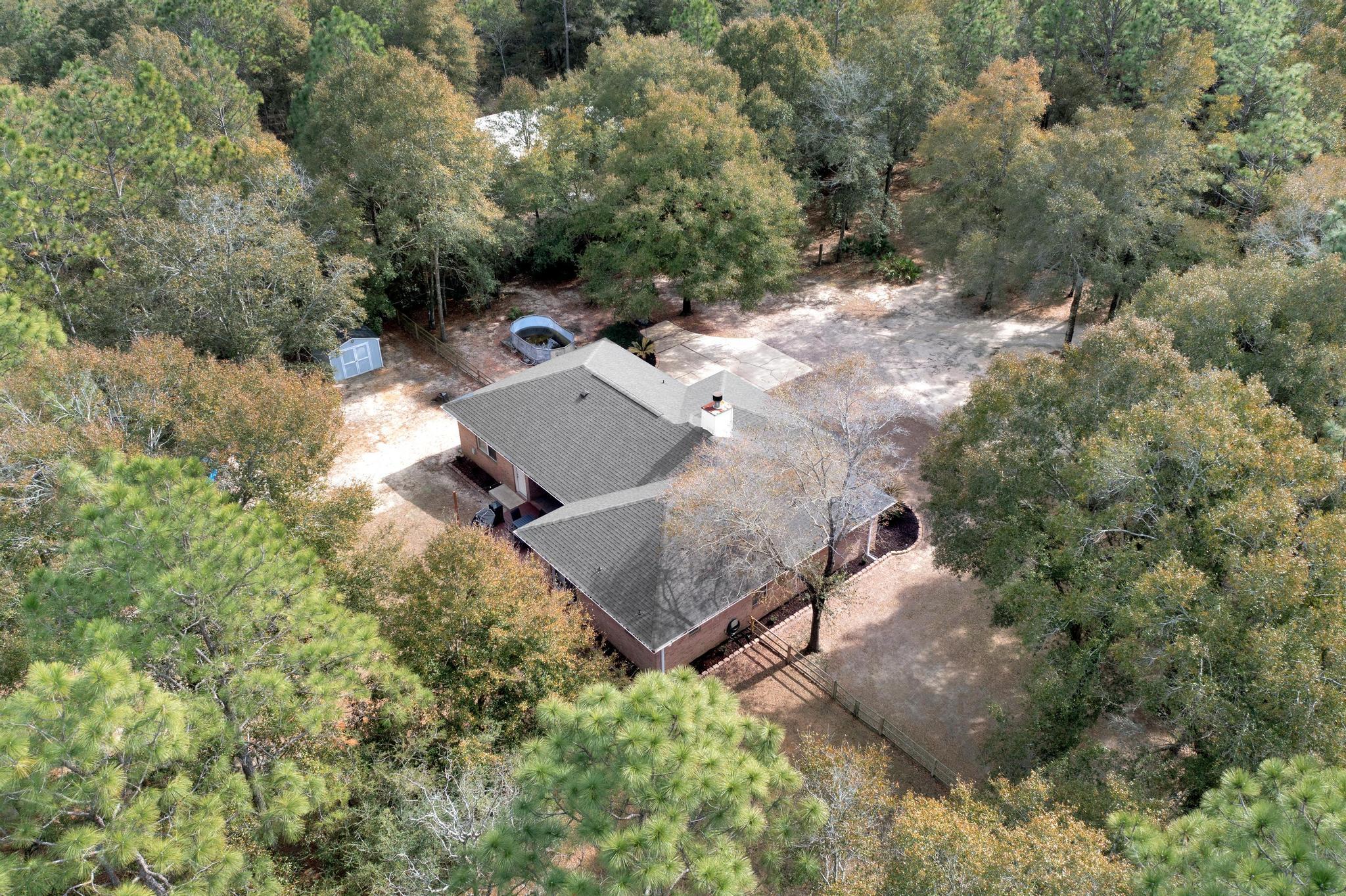 1141 Country Living Road Baker, FL 32531 - Photo 56 of 60 an aerial view of a house with a yard