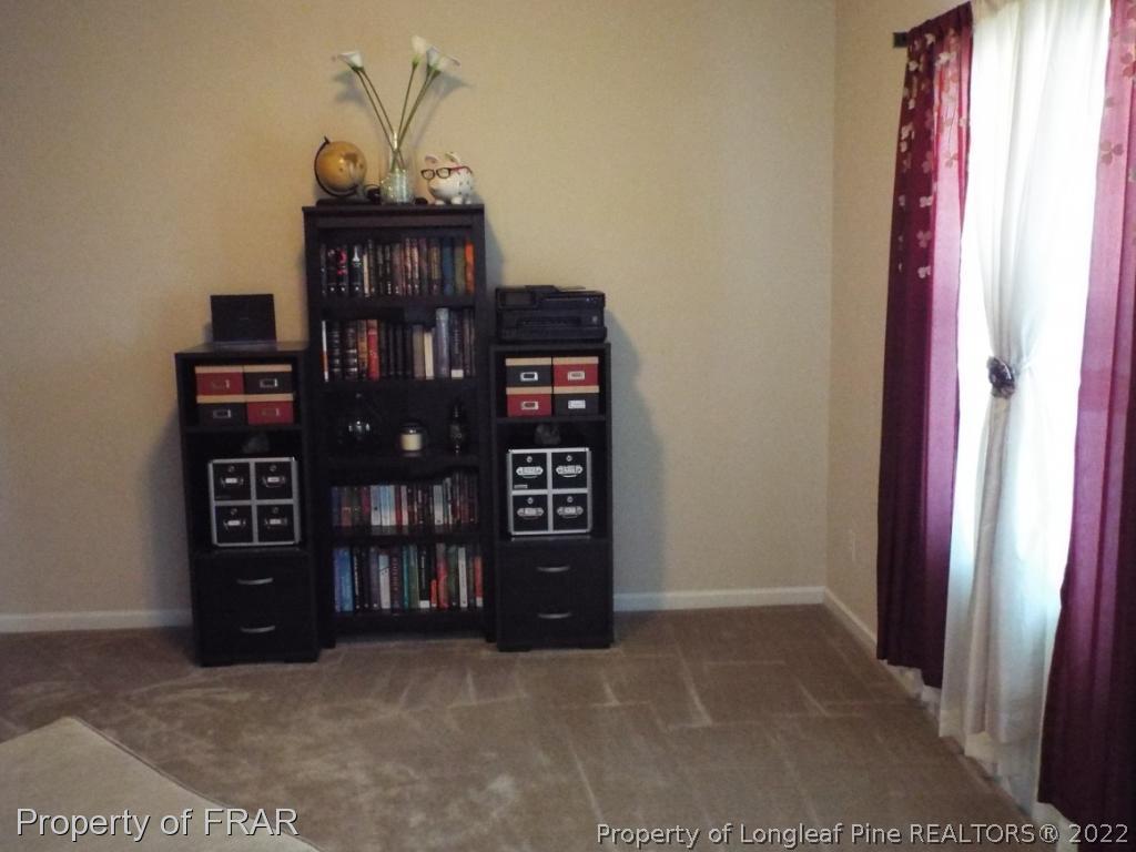 14 Citadel Street Cameron, NC 28326 - Photo 16 of 33 a view of a bedroom with a book shelf