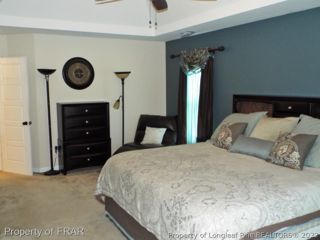 14 Citadel Street Cameron, NC 28326 - Photo 19 of 33 a bedroom with a bed and a table