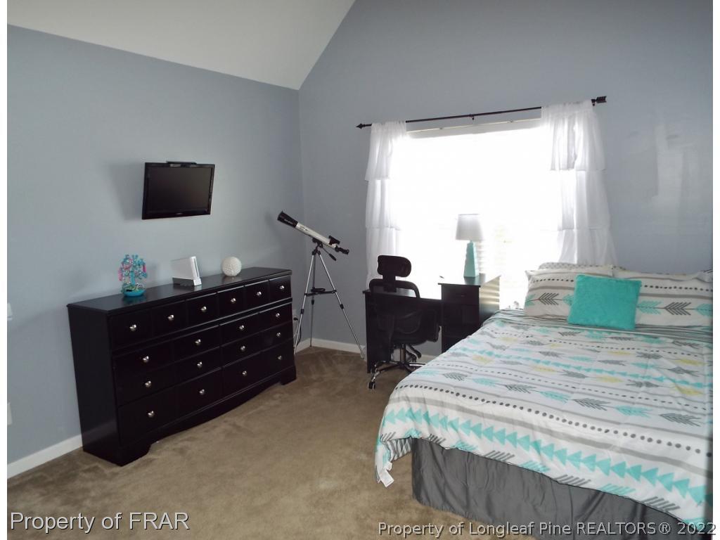14 Citadel Street Cameron, NC 28326 - Photo 25 of 33 a bedroom with a bed and a flat screen tv
