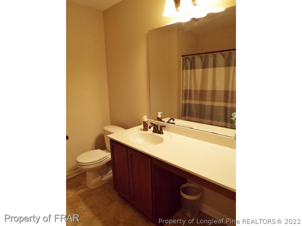 14 Citadel Street Cameron, NC 28326 - Photo 26 of 33 a bathroom with a sink a toilet and shower