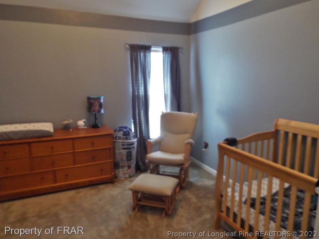 14 Citadel Street Cameron, NC 28326 - Photo 27 of 33 a bedroom with furniture and a window