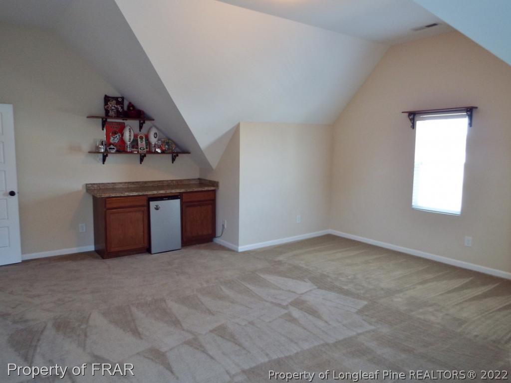 14 Citadel Street Cameron, NC 28326 - Photo 29 of 33 an empty room with windows and cabinet