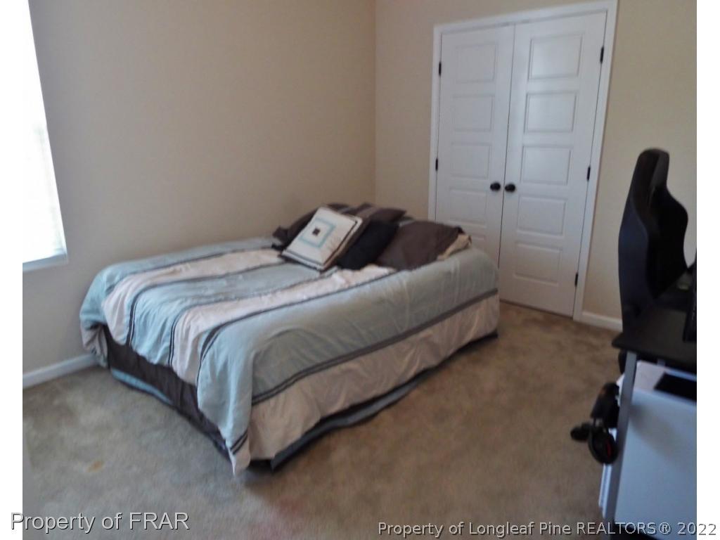 14 Citadel Street Cameron, NC 28326 - Photo 31 of 33 a bedroom with a bed tv and a window