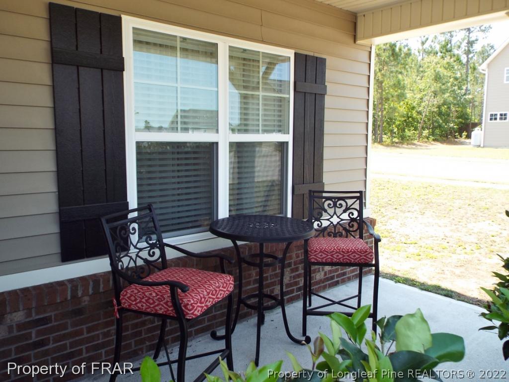 14 Citadel Street Cameron, NC 28326 - Photo 4 of 33 a view of a chairs and table in patio
