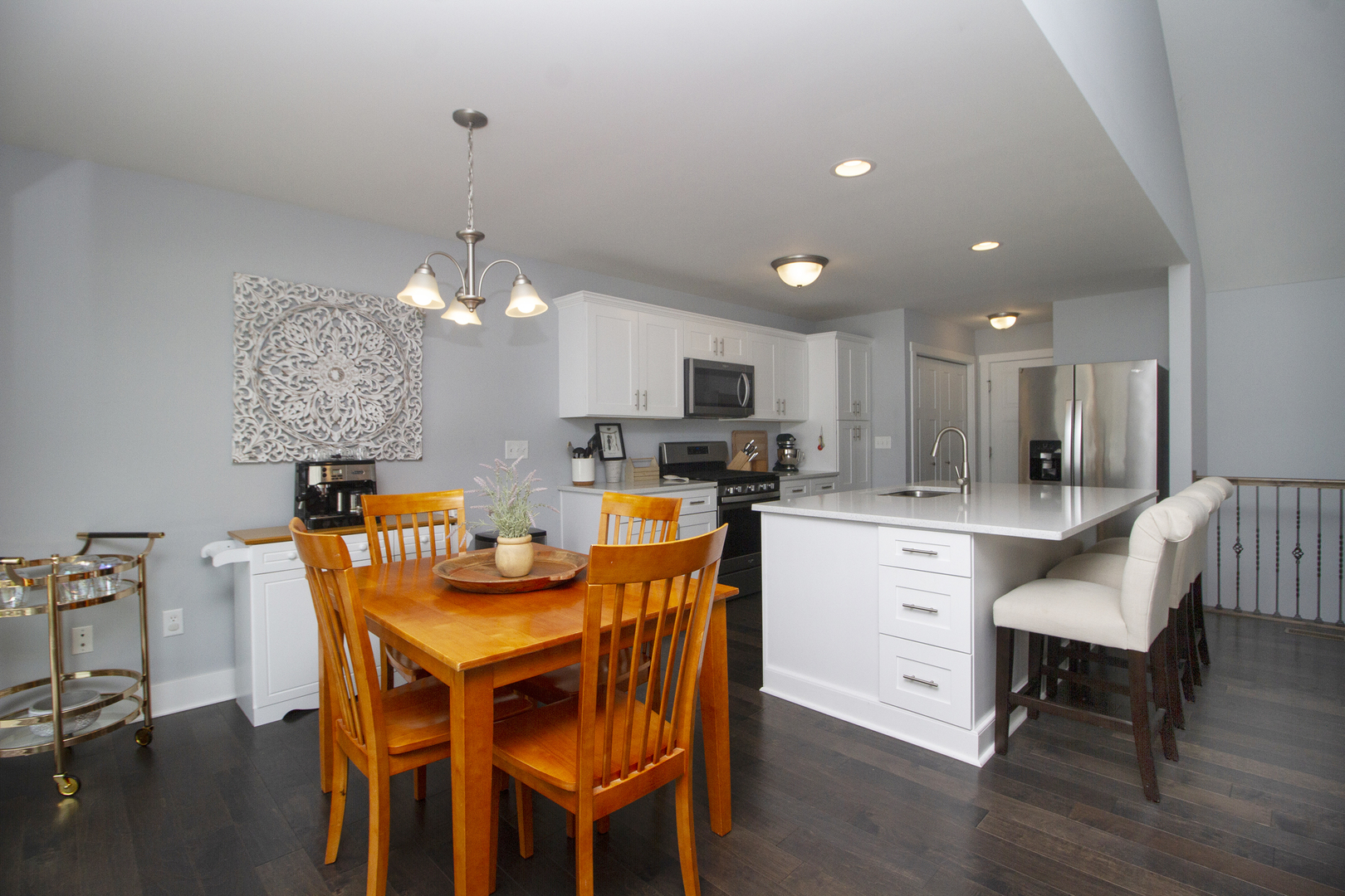 6104 Park View Drive Bourbonnais, IL 60914 - Photo 12 of 31 a dining area with stainless steel appliances kitchen island granite countertop a table and chairs