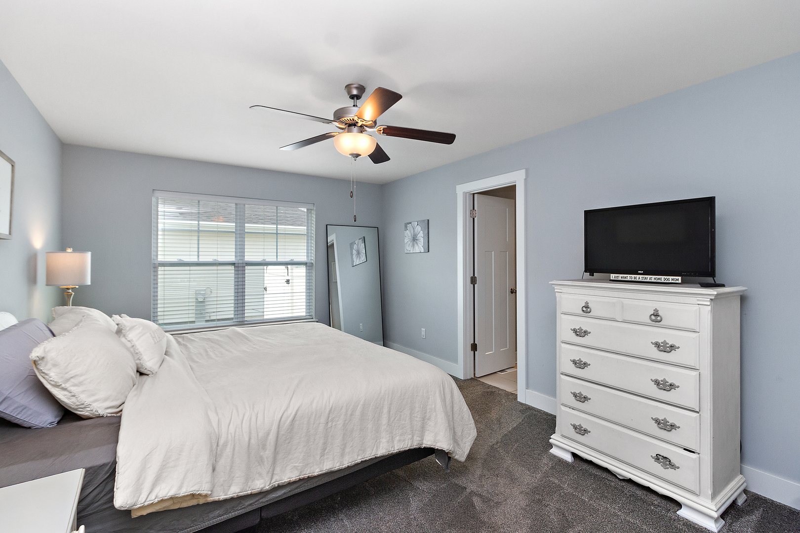 6104 Park View Drive Bourbonnais, IL 60914 - Photo 15 of 31 a bedroom with a bed and a flat screen tv