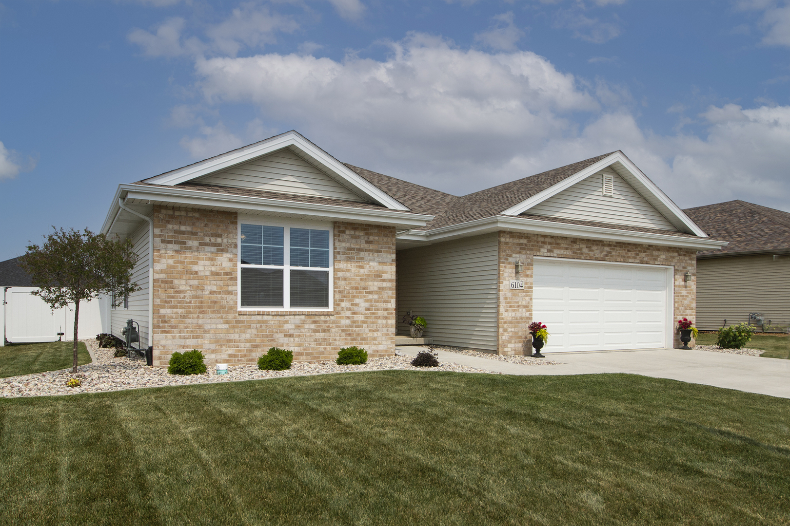 6104 Park View Drive Bourbonnais, IL 60914 - Photo 2 of 31 a front view of a house with a yard and garage