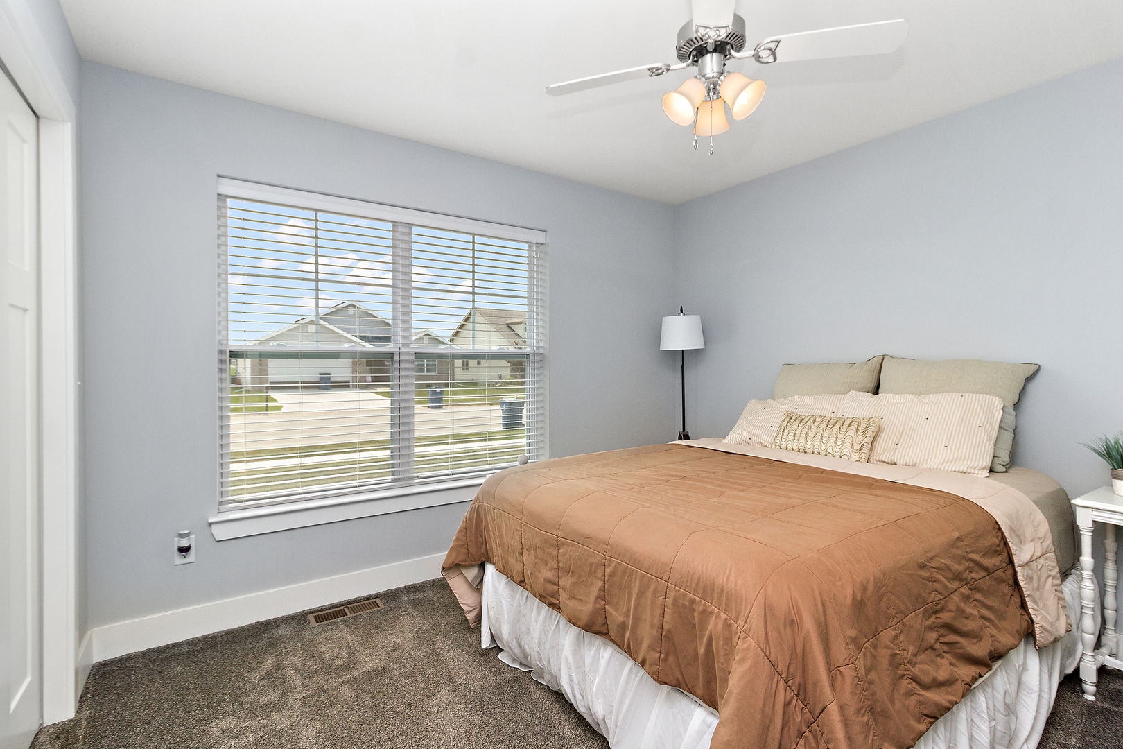 6104 Park View Drive Bourbonnais, IL 60914 - Photo 22 of 31 a bedroom with a bed and a window