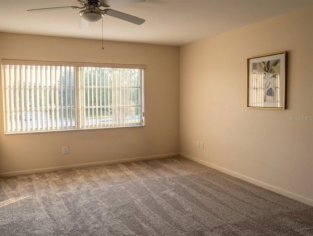 4744 Azalea Drive, Unit 204 New Port Richey, FL 34652 - Photo 10 of 20 an empty room with a window