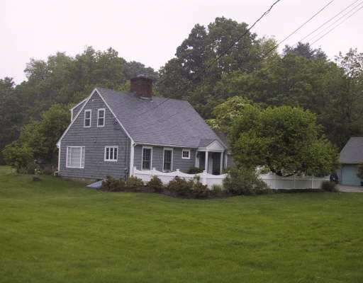 1364 Rock Rimmon Road Stamford, CT 06903 - Photo 1 of 1 a front view of a house with a garden and yard