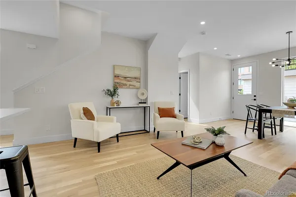 a living room with furniture and a table