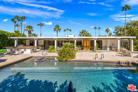 a view of a house with a swimming pool