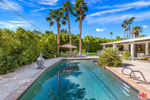 a view of a swimming pool with a patio