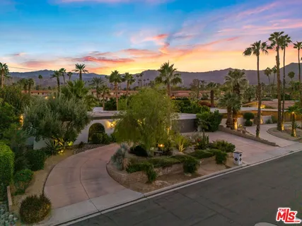a view of a garden with a houses