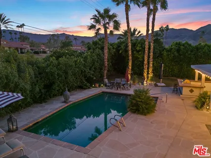 a view of a swimming pool with a patio
