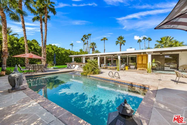 a view of a swimming pool with a patio
