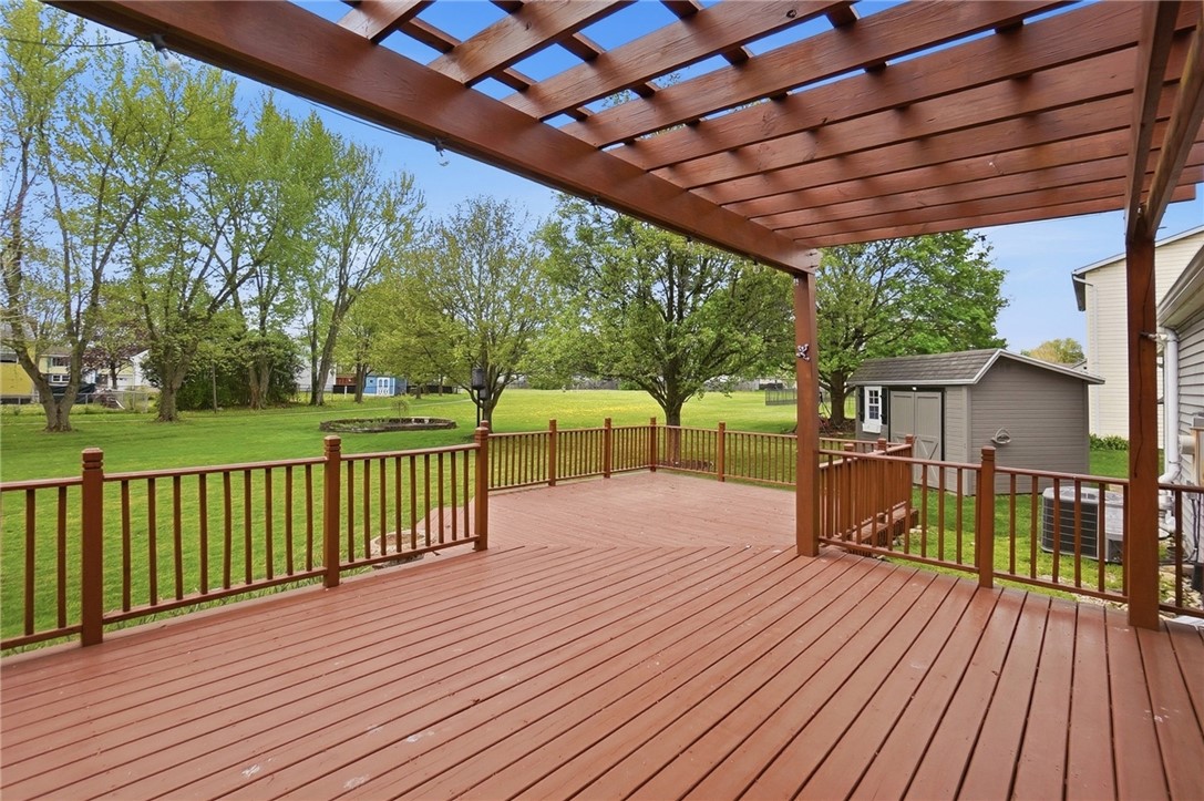 135 Concord Farm Road Englewood, OH 45322 - Photo 39 of 46 This spacious deck, complete with a pergola, offers ample outdoor living space.