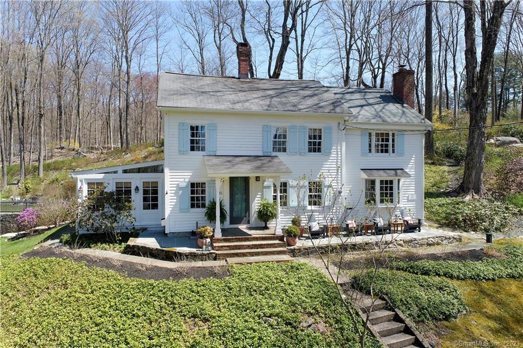 20 Blackman Road Ridgefield, CT 06877 - Photo 1 of 1 a front view of a house with a yard