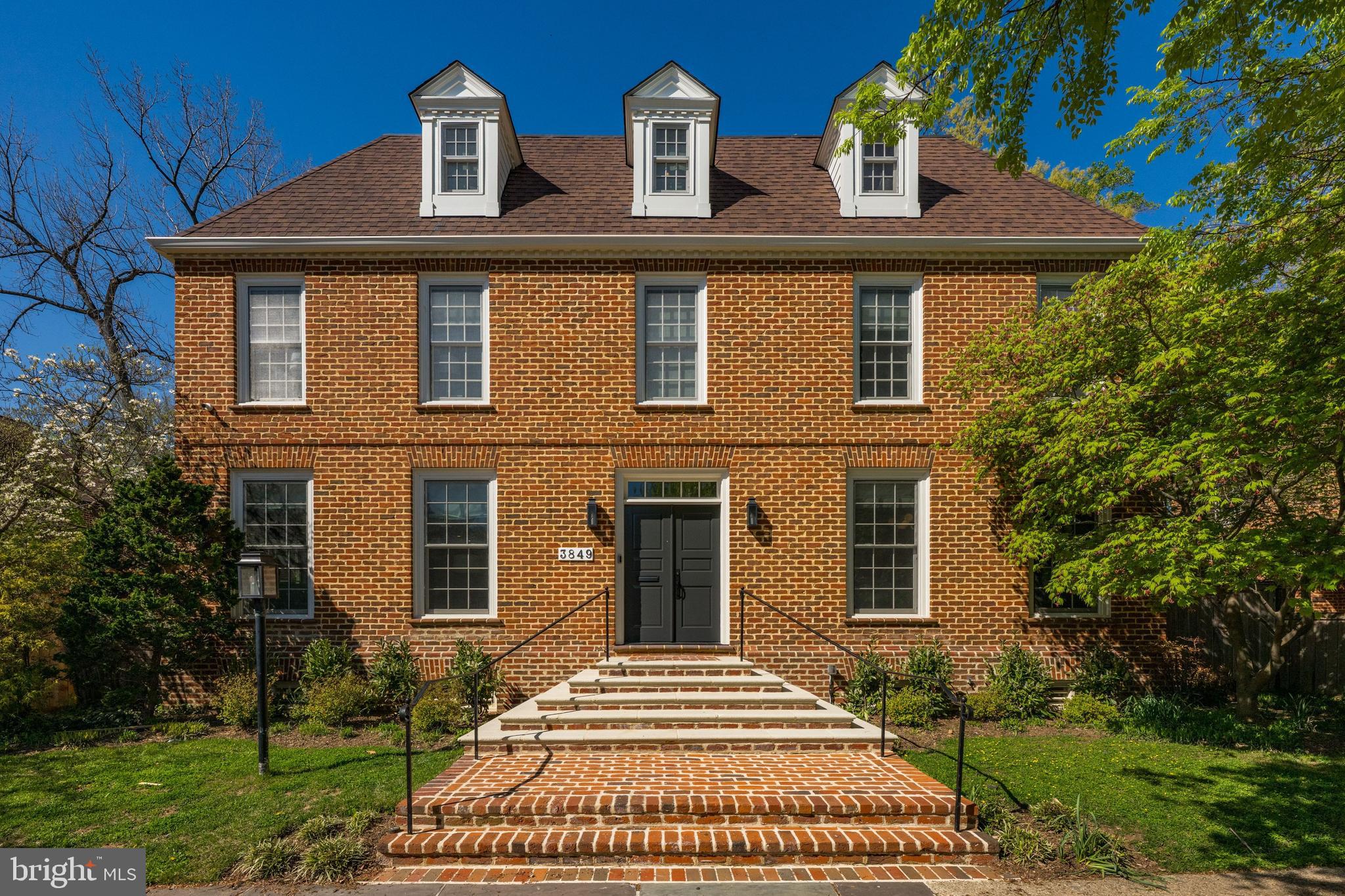 3849 Macomb Street Northwest Washington, DC 20016 - Photo 1 of 60 front view of house with a yard