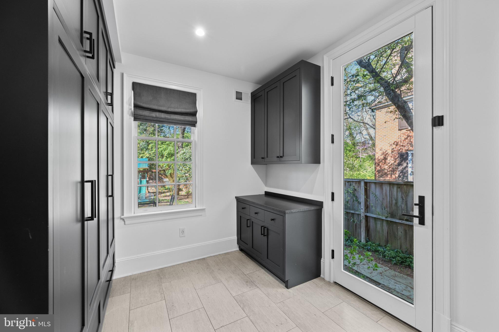 3849 Macomb Street Northwest Washington, DC 20016 - Photo 13 of 60 a view of a kitchen with an entryway and wooden floor