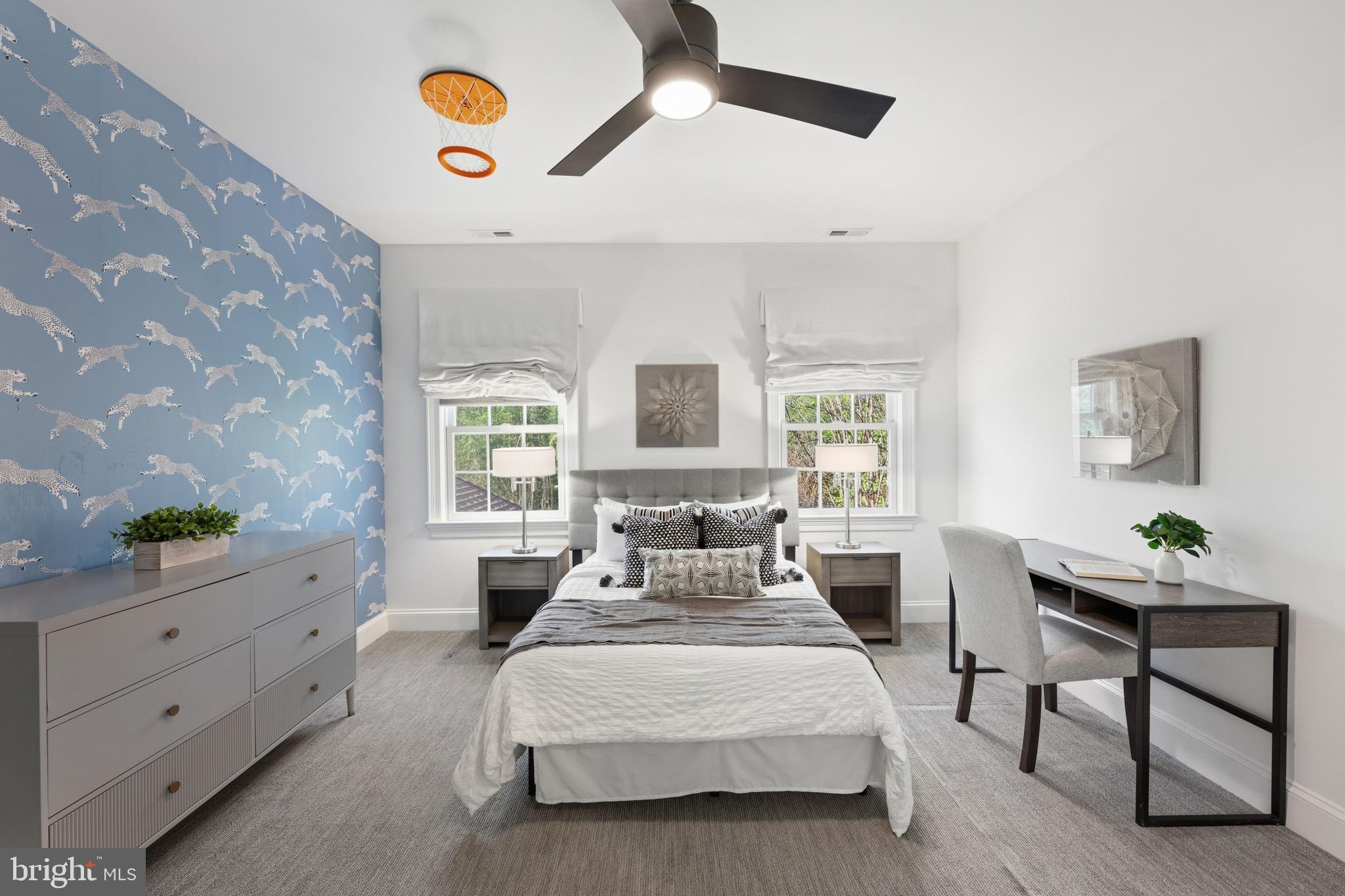 3849 Macomb Street Northwest Washington, DC 20016 - Photo 22 of 60 a spacious bedroom with a bed and a window