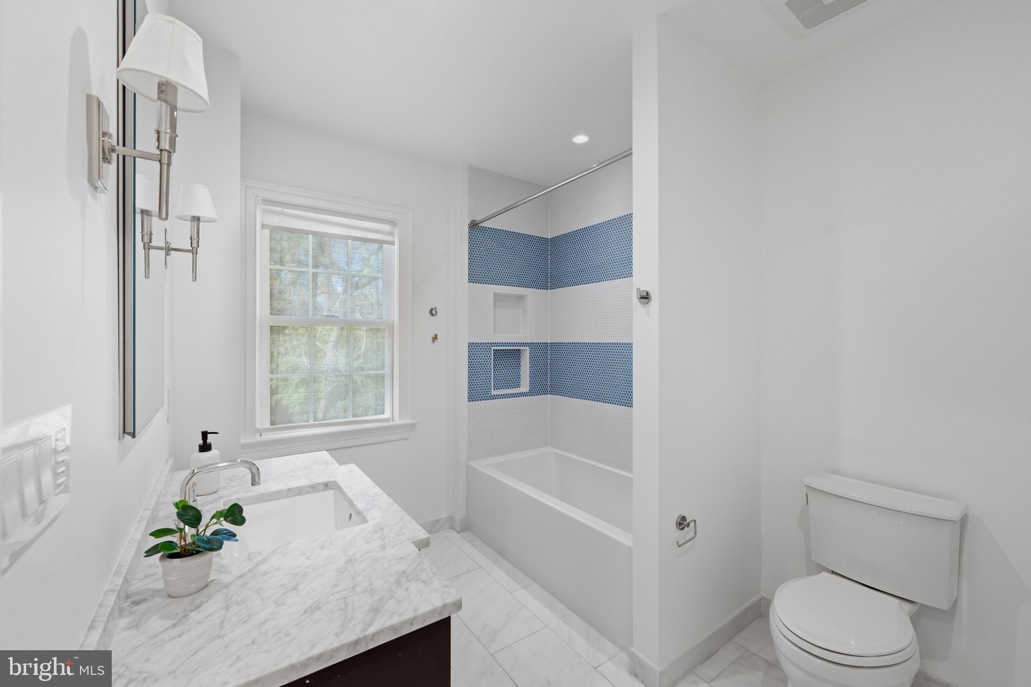 3849 Macomb Street Northwest Washington, DC 20016 - Photo 25 of 60 a white bath tub sitting next to a white toilet