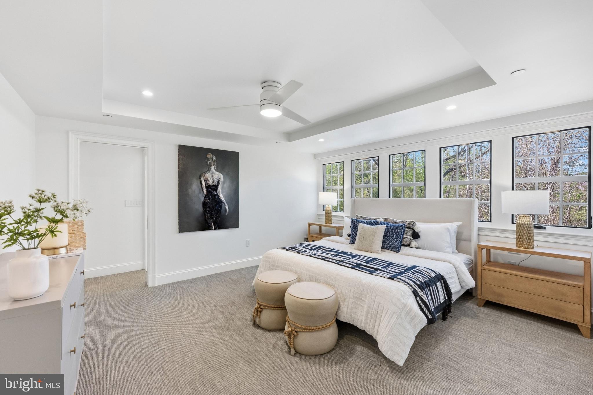 3849 Macomb Street Northwest Washington, DC 20016 - Photo 27 of 60 a spacious bedroom with a bed and a large window
