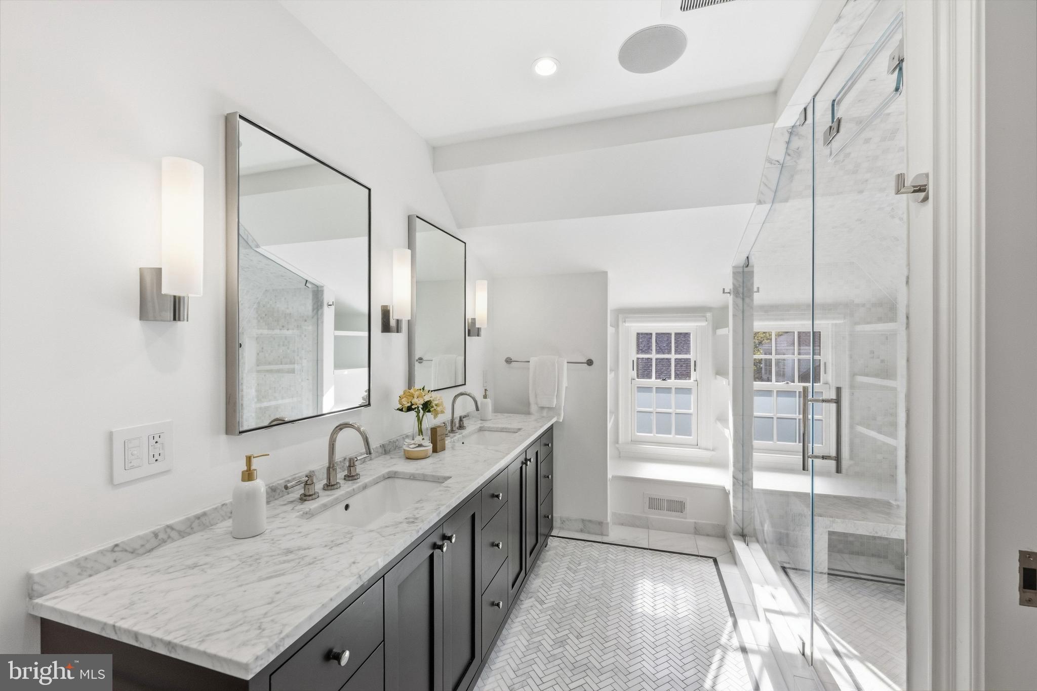 3849 Macomb Street Northwest Washington, DC 20016 - Photo 29 of 60 a spacious bathroom with a granite countertop sink mirror and double