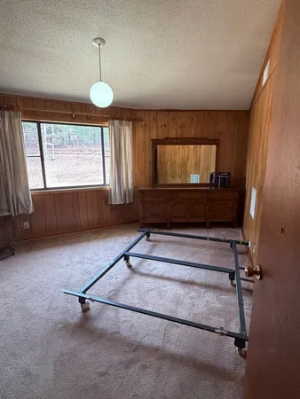 a living room with a couch and a large window