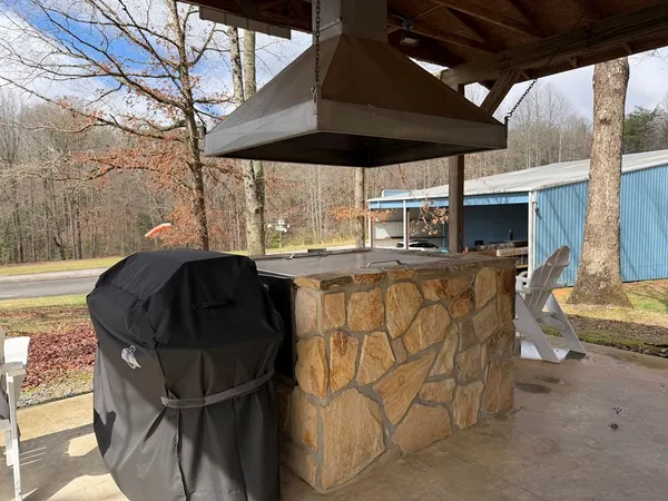 a view of a chairs and table in the patio