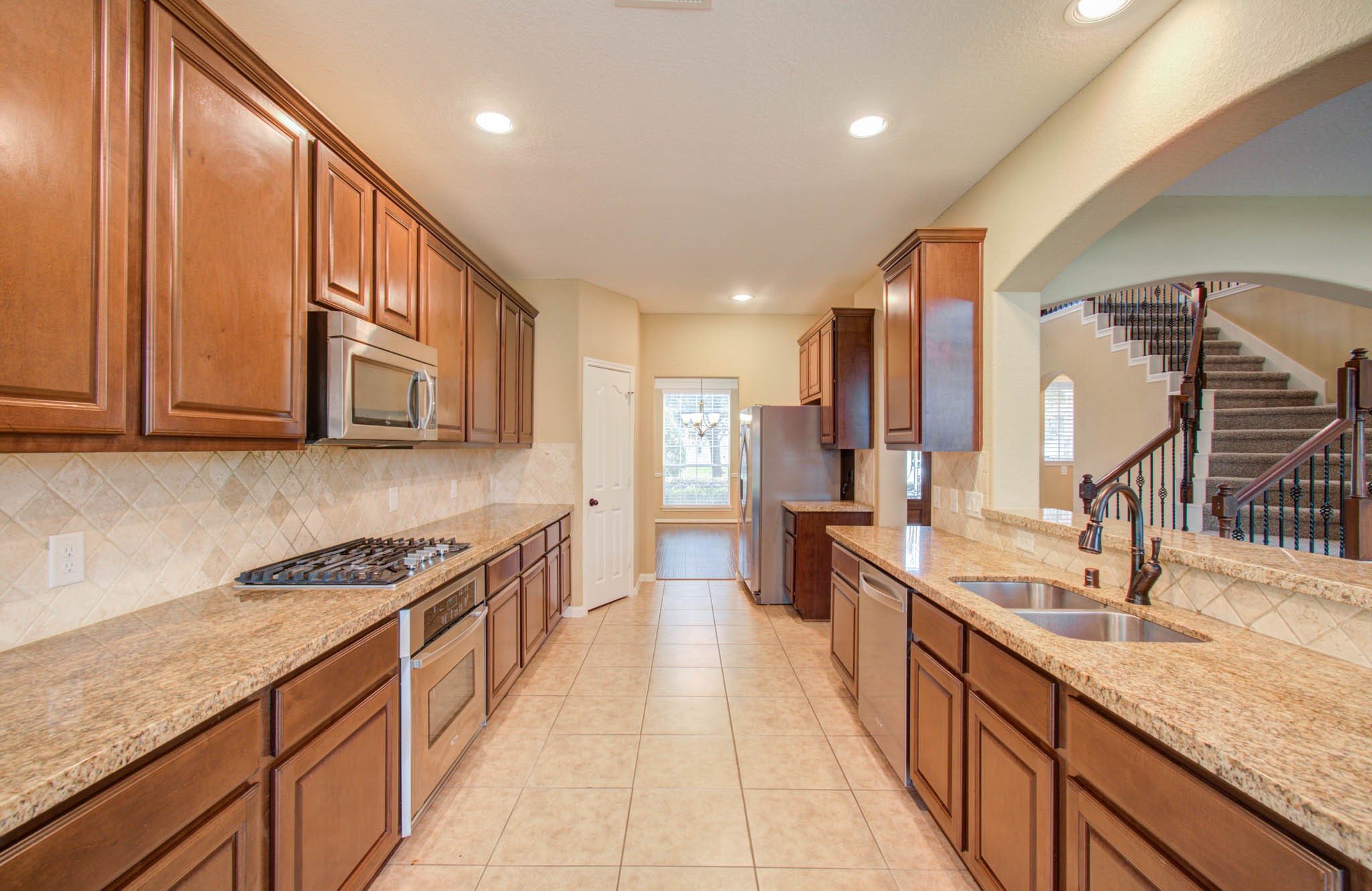 21331 Parham Circle Spring, TX 77388 - Photo 17 of 48 Galley kitchen featuring 42" maple cabinets.