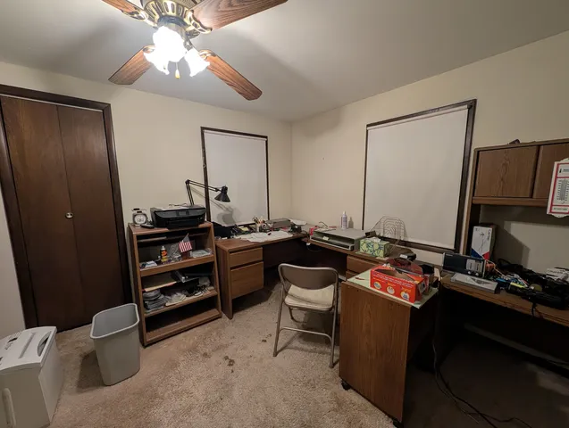 a view of a workspace with furniture