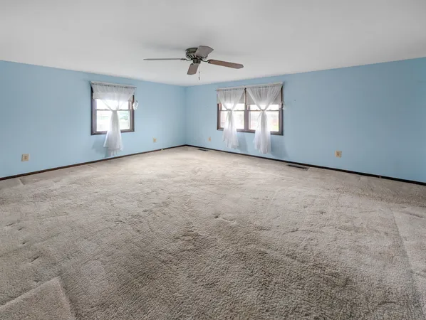 a view of empty room with windows