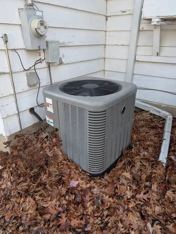 a backyard of a house with a tree