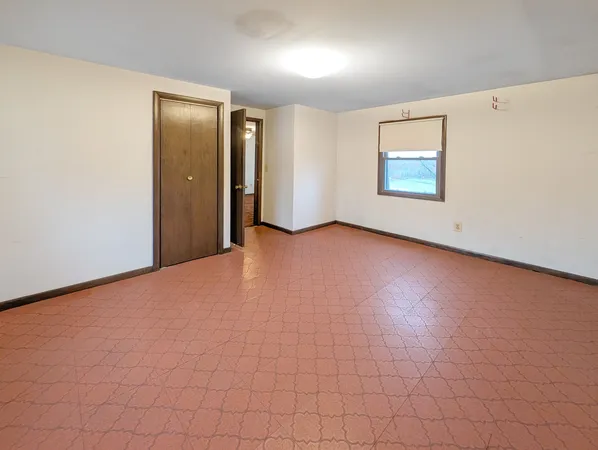 an empty room with windows