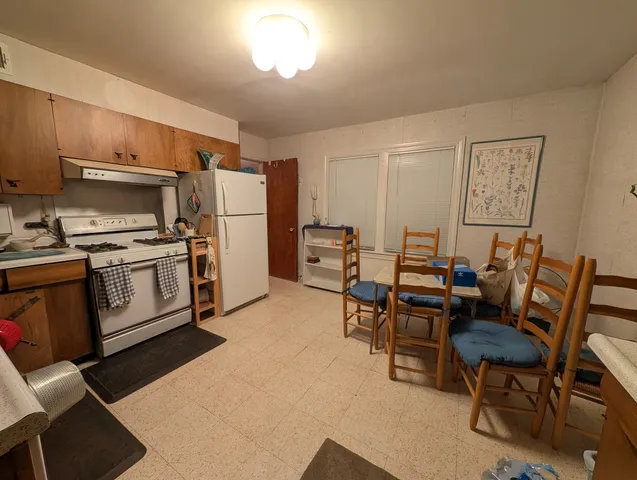 a room with furniture and wooden floor