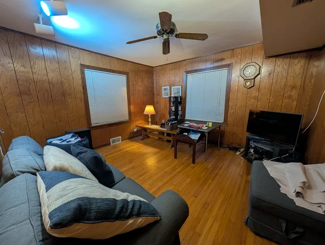 a bedroom with bed and a window