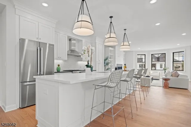 a kitchen with counter top space cabinets and stainless steel appliances