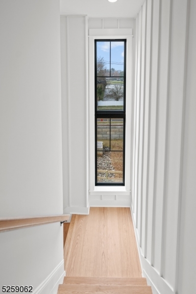 147 Center Avenue, Unit 20 Old Tappan, NJ 07675 - Photo 19 of 48 a view of an empty room with wooden floor and a window