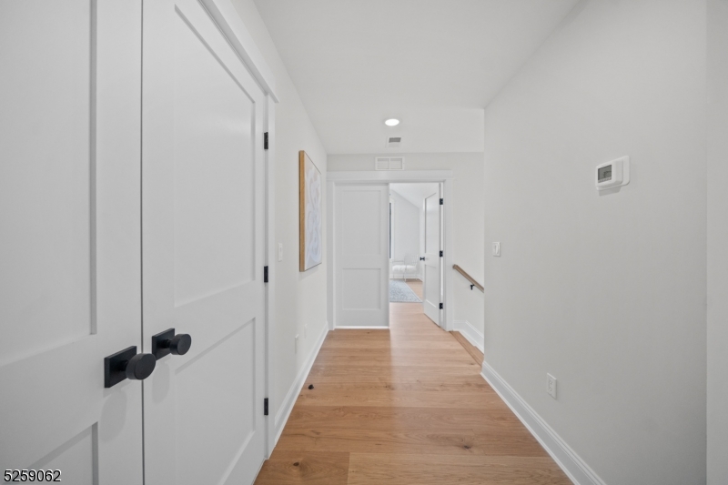 147 Center Avenue, Unit 20 Old Tappan, NJ 07675 - Photo 20 of 48 a view of a hallway with white walls
