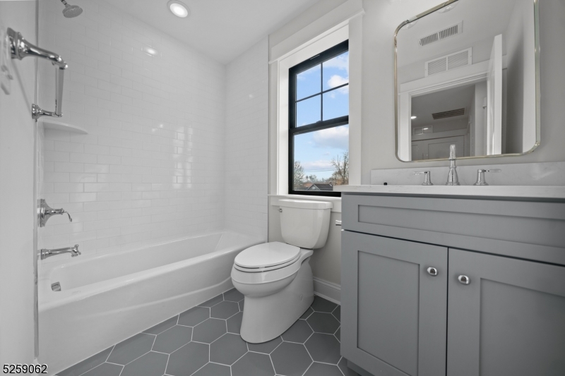 147 Center Avenue, Unit 20 Old Tappan, NJ 07675 - Photo 35 of 48 a bathroom with a sink toilet and shower