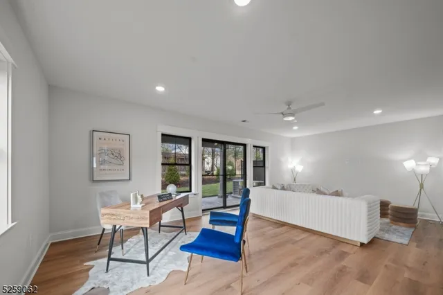 a living room with furniture and large window